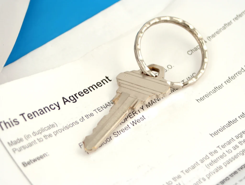 Seattle rental home with checklist illustrating 2026 Just Cause Eviction Ordinance notice and lease renewal requirements