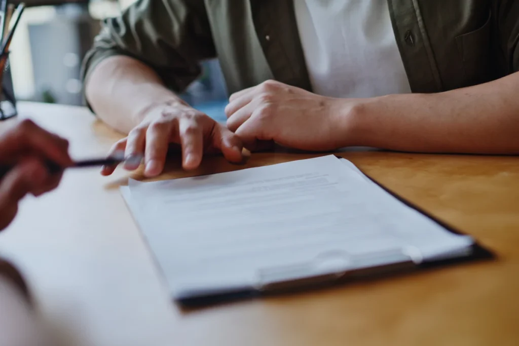 Two people reviewing a document together at a desk